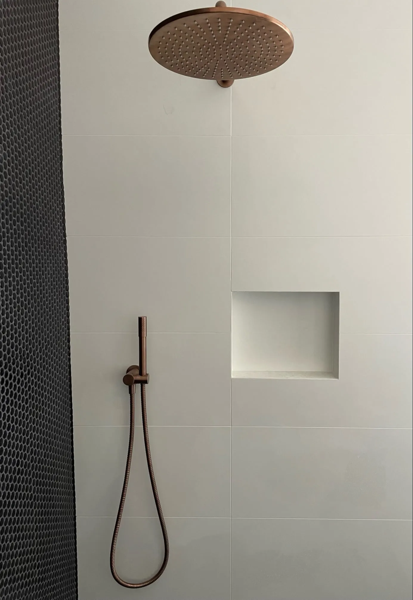 Bathroom renovation at Lorn with copper rain shower and hand shower